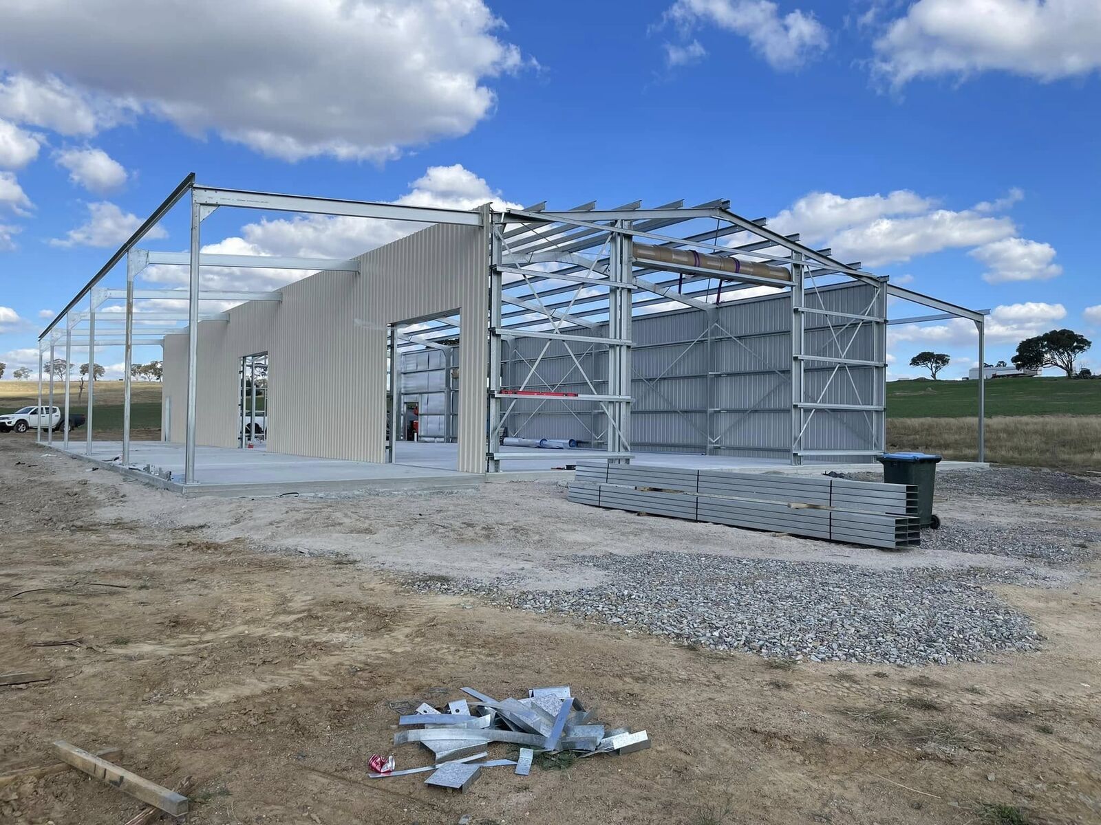 Steel portal frame part-clad in Colorbond during construction of a custom shed