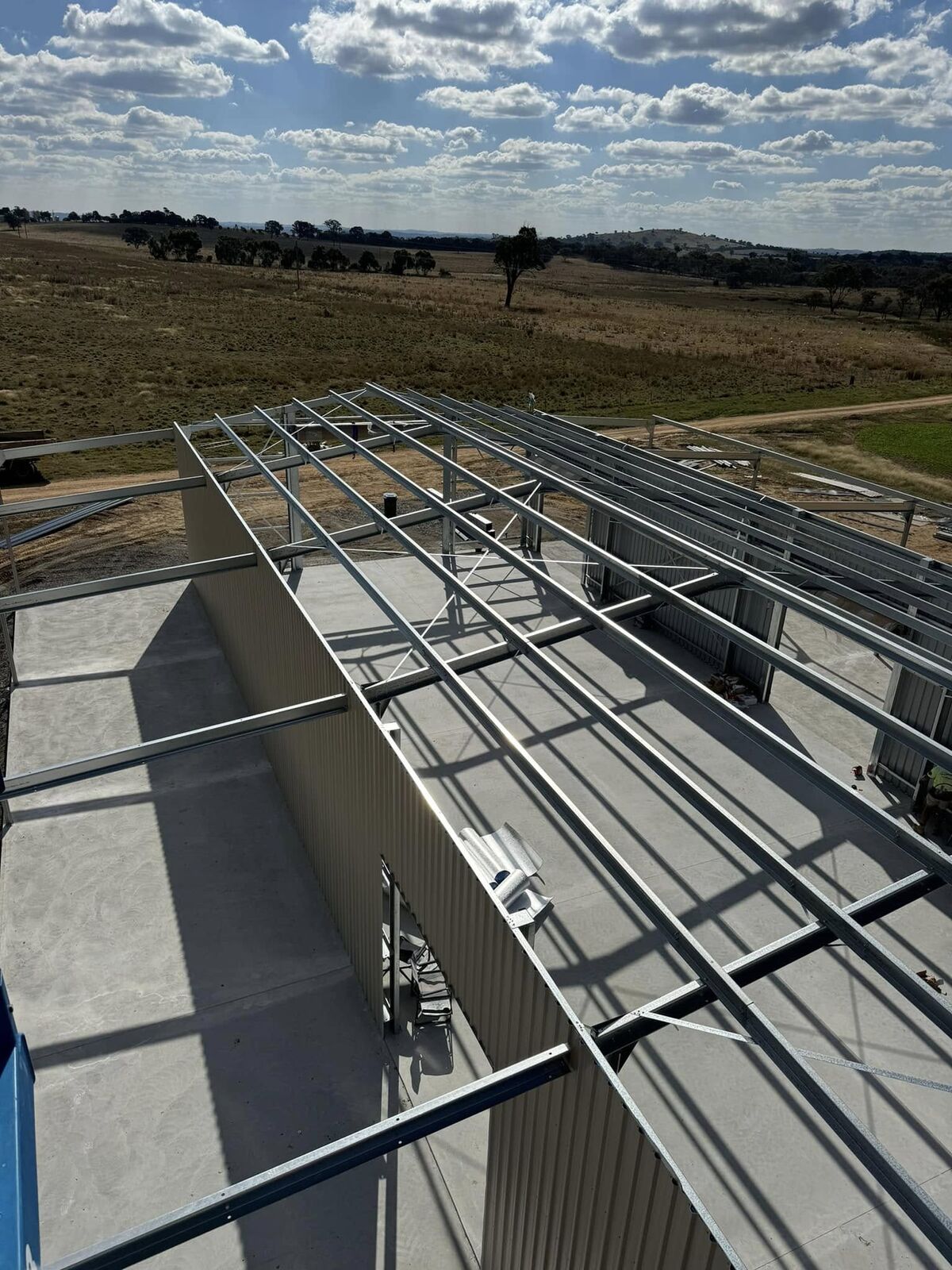 Pre-punched steel purlins and framing components laid out on site ready to assemble