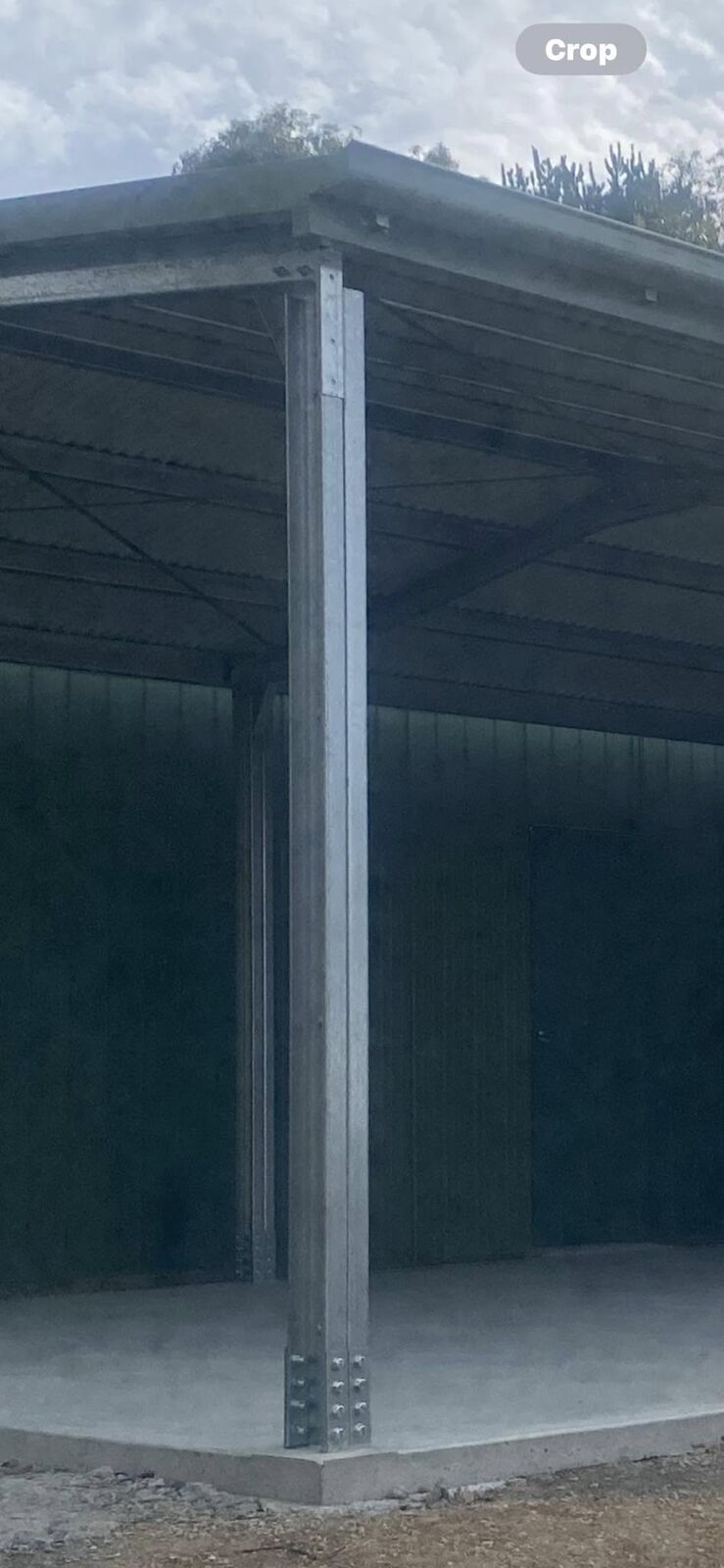 Steel shed framing and roof structure viewed from inside during construction
